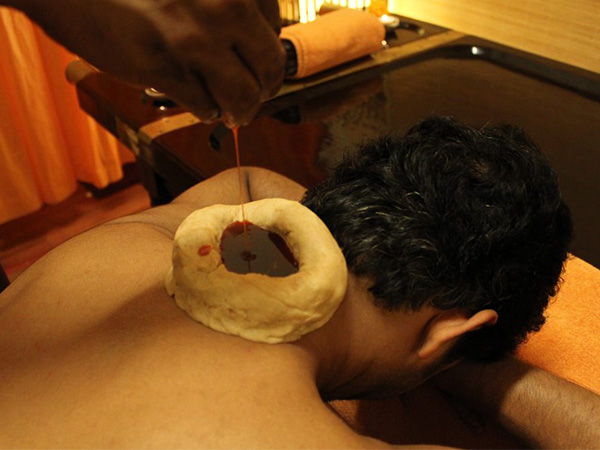 Man having Greeva Basti Therapy