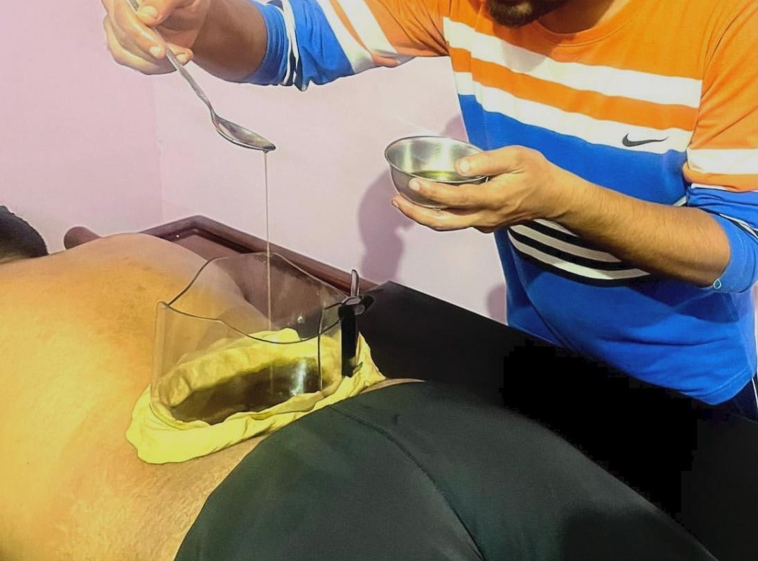 Doctor performing Kati Basti